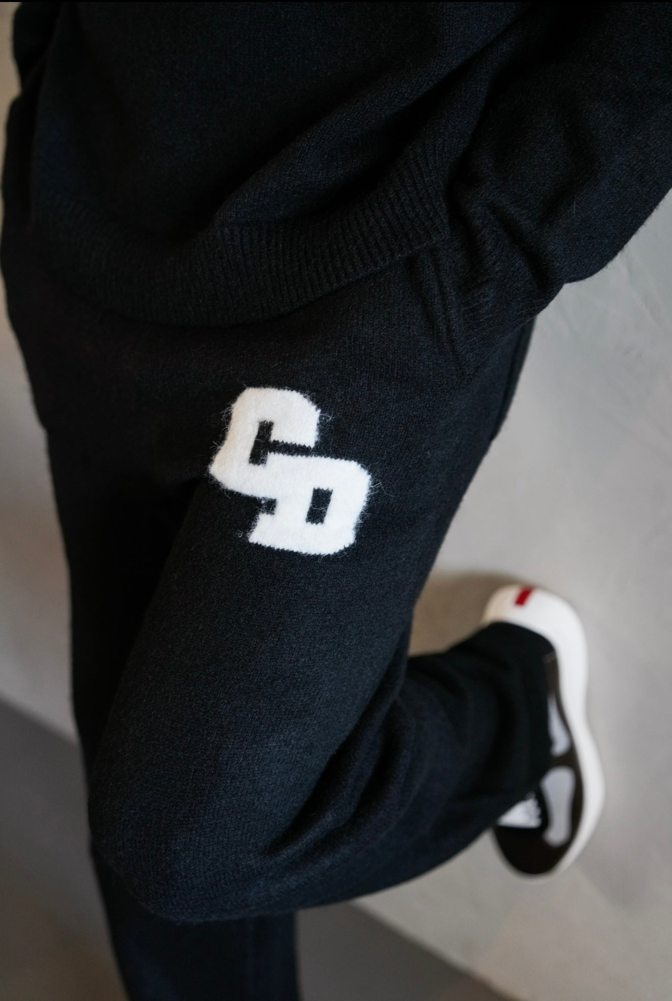 Model view of Cardair CD Logo Knit Black Sweatpants